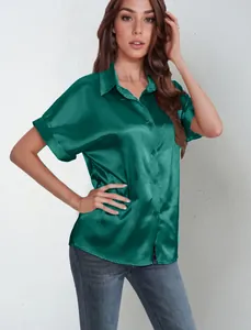 Close-up of elegant green satin short-sleeve button-down shirt with premium sheen