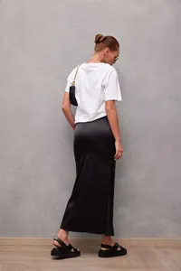 Elegant black satin midi skirt back view showing the luxurious silky fabric sheen