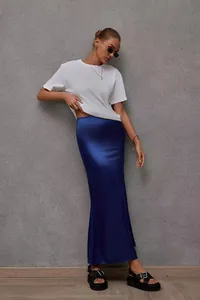 Detailed view of an elegant navy blue satin fishtail midi skirt worn by a model