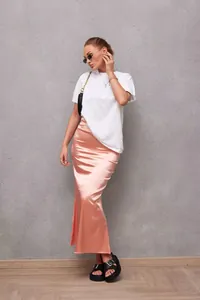 Elegant pink satin fishtail midi skirt featuring a high-shine silk-like fabric texture