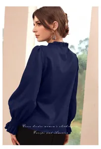 Elegant back view of navy blue satin blouse with ruffle collar and smocked cuffs