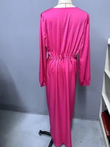 Back view of a pink satin maxi dress with lantern sleeves and elasticated waist