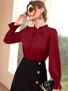 Elegant burgundy wine red satin long sleeve blouse with ruffle neck and tie front detail.