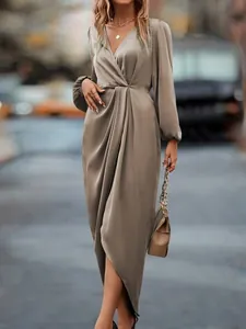 Elegant taupe satin wrap dress featuring lantern sleeves and an irregular hem for women.