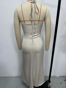 Detailed back view of an elegant champagne satin halter neck long dress with hidden zipper