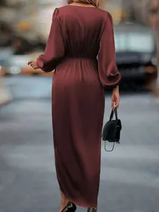 Elegant burgundy satin long sleeve dress with lantern sleeves and back view detail