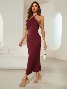 Full view of an elegant burgundy satin halter evening gown with an open-back design