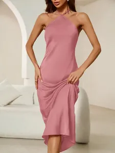 Elegant pink satin halter neck maxi dress with a silky finish shown on a model