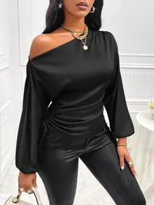 Elegant black satin blouse with asymmetrical one-shoulder design and lantern sleeves
