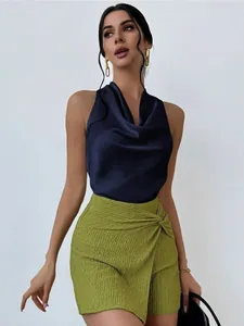 Professional model wearing an elegant navy blue satin sleeveless top with a stylish cowl neck