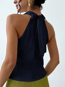 Back detail of a navy blue satin halter top with an elegant bow tie fastening.