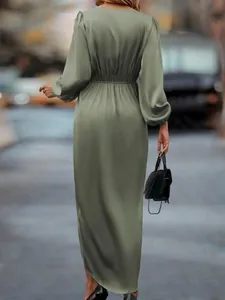 Elegant sage green satin maxi dress with lantern sleeves and back view slit detail