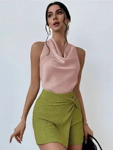 Elegant pink satin sleeveless halter blouse paired with a green textured wrap skirt