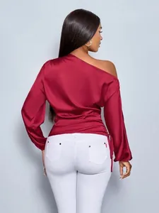 Back view of burgundy satin one-shoulder blouse with asymmetrical long sleeves