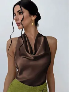 Close-up detail of an elegant brown satin sleeveless shirt with cowl neck drape