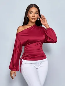 Elegant wine red satin blouse featuring an asymmetric one-shoulder design and ruched waist
