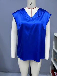 Close-up of a vibrant royal blue satin V-neck sleeveless blouse shown on a mannequin