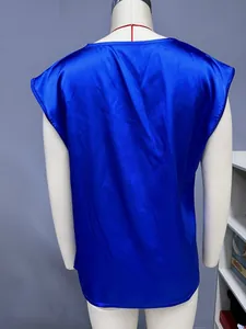 Back view of a royal blue satin blouse on a mannequin showing the fabric luster