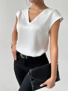 Macro detail of elegant white satin V-neck sleeveless blouse showing fabric texture and fit