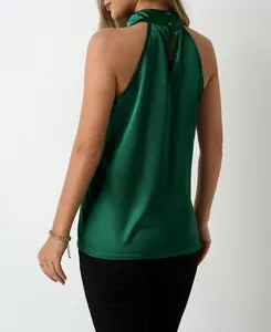 Back view of a sleek emerald green satin halter neck top with button closure detail