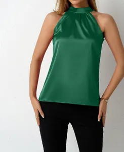 Detailed view of women's elegant dark green satin halter neck sleeveless top with pleats
