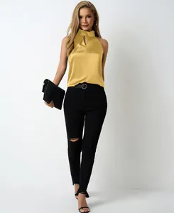 Model wearing elegant yellow satin sleeveless top with stylish V-neck detail for summer season