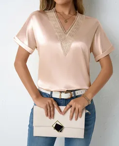 Elegant champagne satin V-neck blouse with intricate lace trim and silky texture