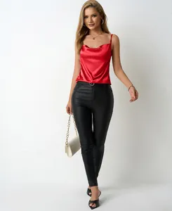 Elegant red satin camisole top for women styled with sleek black faux leather pants