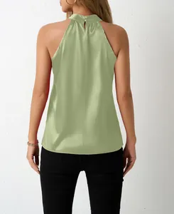Back view detail of an elegant sage green satin halter neck top with button closure