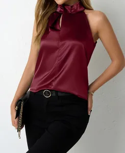 Close-up of wine red satin halter neck sleeveless top for women with elegant silk texture.
