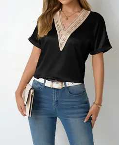 Detailed close-up of a black satin V-neck t-shirt with elegant beige lace trim.