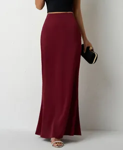 Detailed view of the elegant burgundy satin maxi skirt featuring a high-waist design.
