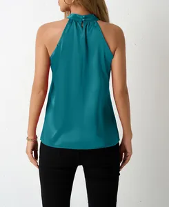 Close-up back view of a teal satin halter neck sleeveless top with button closure