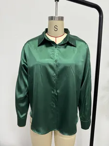 Front view of an emerald green satin shirt for women with a button-down collar