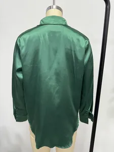 Back view of an oversized emerald green satin shirt with long sleeves for women