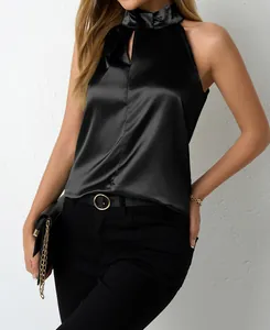 Elegant black satin halter neck top with V-neck detail shown on a model