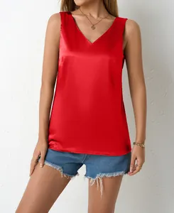Close-up of a vibrant red satin V-neck tank top showing its luxurious silky texture