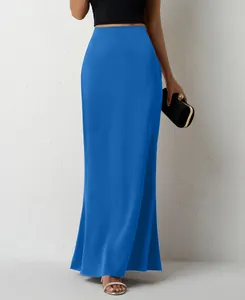 Detail view showing the elegant glossy texture of this blue satin maxi skirt on a model