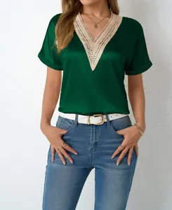 Detailed view of elegant green satin V-neck blouse featuring delicate lace trim