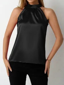 Elegant black satin halter-neck sleeveless blouse for a sophisticated chic summer look.