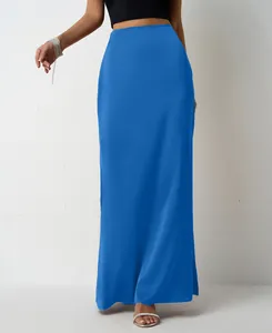 Detail view of a vibrant blue satin maxi skirt with a smooth and flowing texture