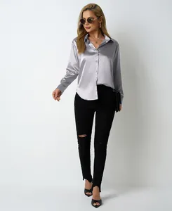 Elegant silver satin button-up shirt for women, loose fit style with V-neck collar detail.