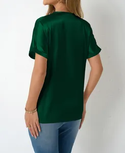Elegant dark green satin t-shirt shown from the back featuring a smooth silky texture