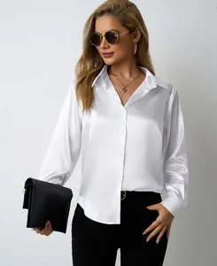 Close-up of elegant white satin long sleeve shirt with v-neck and collar detail