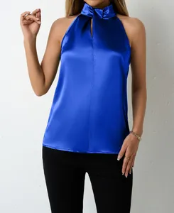 Detail shot of a vibrant royal blue satin halter neck top featuring elegant neck tie