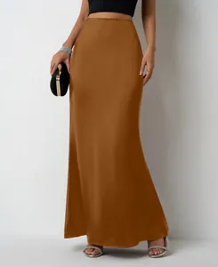 Close-up of brown satin maxi skirt with smooth silk texture and elegant drape