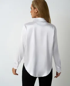 Rear view of white satin long-sleeve blouse with rounded hem and relaxed fit