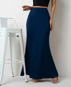 Detail view showing the elegant drape and texture of the navy blue satin maxi skirt.