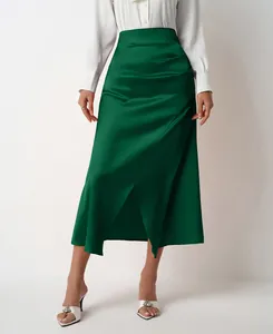 Elegant high-waist green satin maxi skirt with side slit and ruched detailing