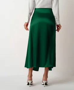 Elegant back view of high-waisted green satin midi skirt featuring a glossy silk-like finish